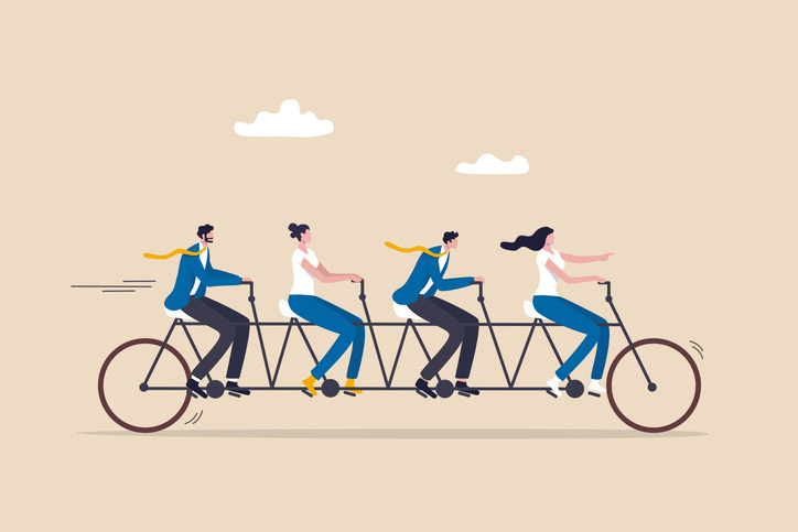 business people employees on tandem bicycle