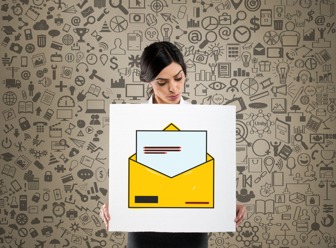 Businesswoman holding placard with inbox e-mail icon