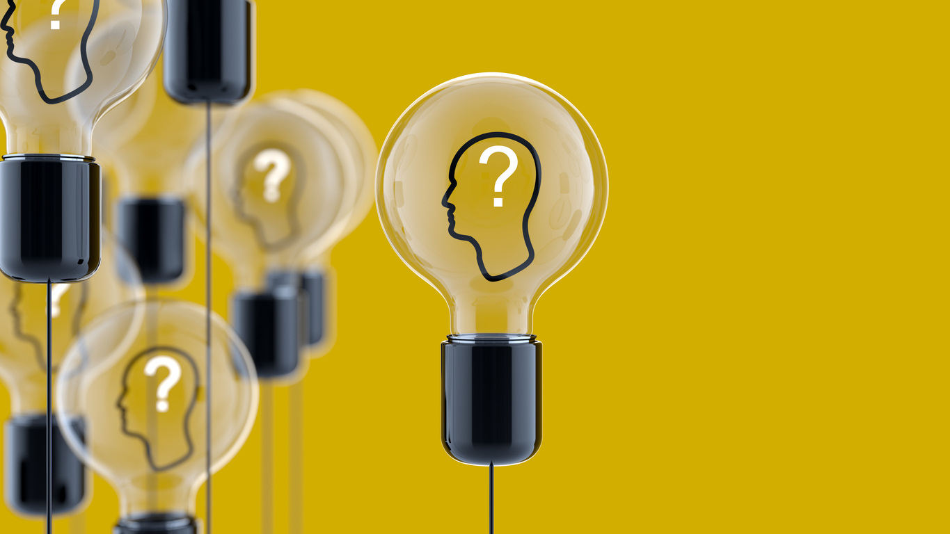 Lightbulb representing innovation and new ideas for marketing solutions on a yellow background.