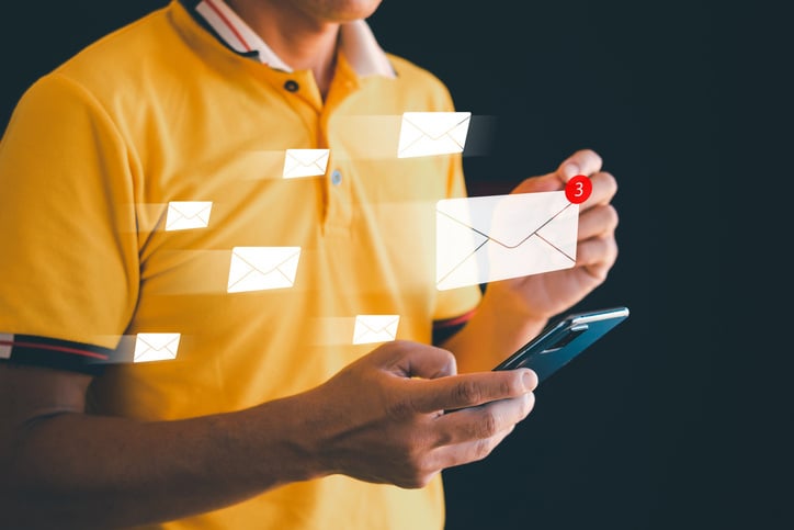 man's hand using smartphone. with floating envelopes